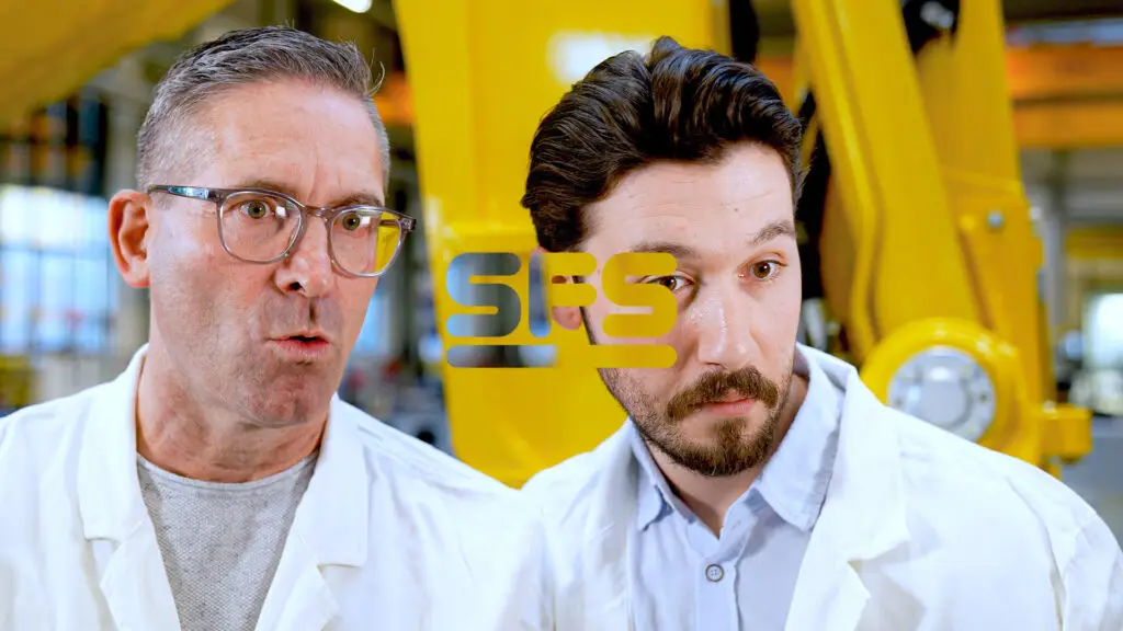 Dieses Bild ist das Anzeigebild für den Portfolio-Beitrag «SFS Produktfinder» und zeigt zwei Ingenieure, die verblüfft auf den neuen SFS Produktfinder blicken. In der Mitte des Bildes ist das SFS Logo zu sehen.